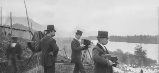 19th century photograph of Canadian settlers photographing the landscape